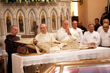roman-catholic-priests-venerate-adore-and-wordhip-in-front-of-a-skeleton.jpg